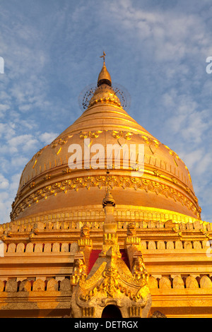 People walk around Shwezigon Paya, the most important religious site in Nyaung U, Bagan, Burma. Stock Photo