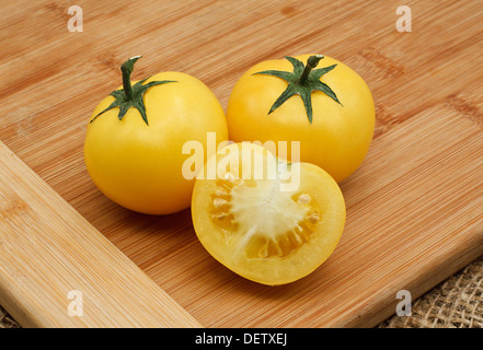 homegrown Yellow tomato harvest from a greenhouse, vegetable produce grown by a keen gardener Stock Photo