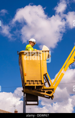 A man replacing Street Lamp bulbs in the Uk Stock Photo