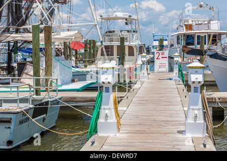 Sign near shrimp boat shows shrimp for sale at the Small Craft Harbor in Biloxi, Mississippi on the Gulf of Mexico Stock Photo