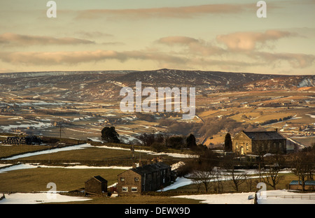 A view taken from Bolster Moor looking towards The Pennines as snow is melting. Stock Photo