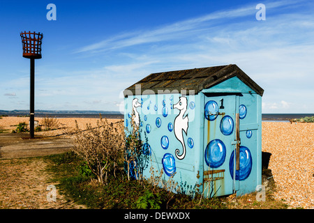 Blue beach hut with painted seahorses at Greatstone Beach, New Romney, Kent, UK. Stock Photo