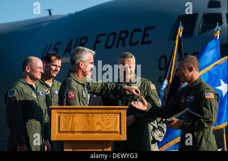Gen. Paul Selva, Air Mobility Command commander, presents the keys to the final U.S. Air Force C-17 Globemaster III to Col. James Fontanella, 315th Airlift Wing commander, during a delivery ceremony Sept. 12, 2013, on the flight line at Joint Base Charles Stock Photo
