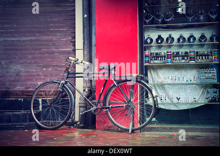 Indian Bicycle parked in front of a shop - street scenes from Mumbai, Maharashtra, India Stock Photo