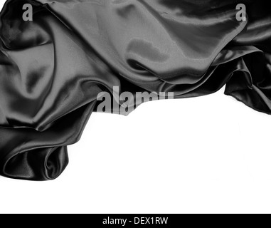 Closeup of rippled black silk fabric on plain background Stock Photo