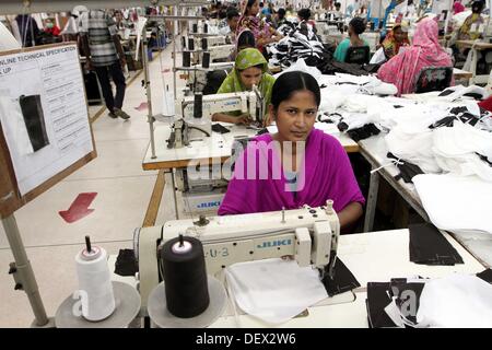 Dhaka, Bangladesh  . 24th Sep, 2013. Bangladeshi woman works in a garments factory in Ashulia Savar in Dhaka on September 24, 2013. Stock Photo