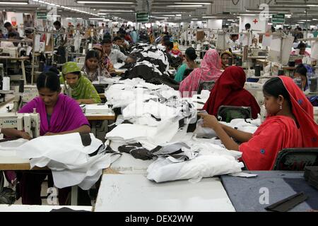 Dhaka, Bangladesh  . 24th Sep, 2013. Bangladeshi woman works in a garments factory in Ashulia Savar in Dhaka on September 24, 2013. Stock Photo