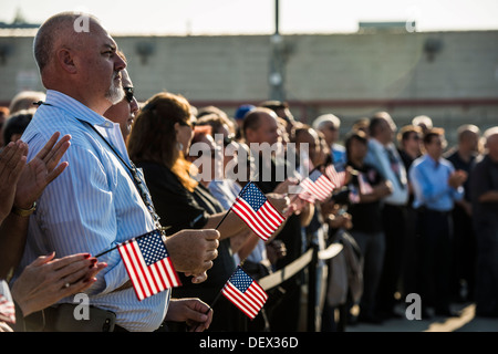 Boeing employees who work on the production of the C-17 Globemaster III hold American flags in support of the military during th Stock Photo