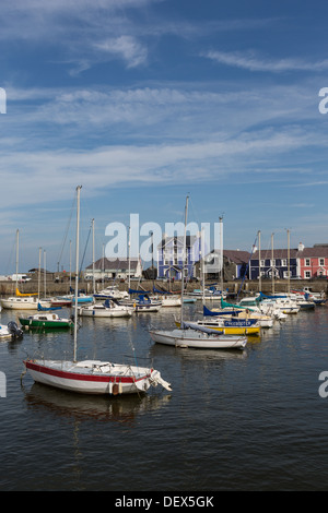 Aberaeron harbour on the coast of Cardigan Bay, with the award winning Harbourmaster Hotel Stock Photo