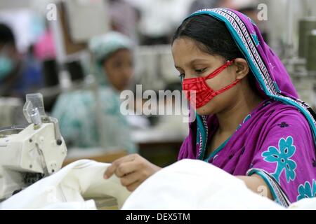 Dhaka, Bangladesh  . 24th Sep, 2013. BANGLADESH, Dhaka : A Bangladeshi woman works in a garments factory in Ashulia Savar in Dhaka on September 24, 2013. Stock Photo