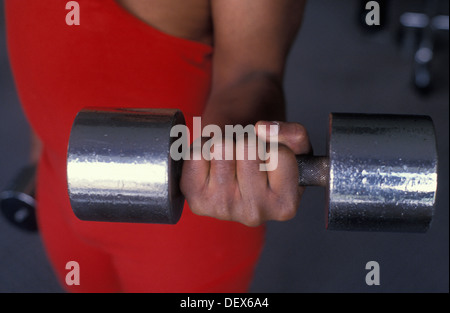 close up black male lifting hand weights Stock Photo