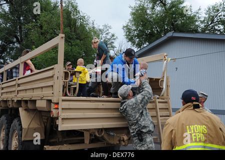 Colorado National Guardsmen assist Boulder County authorities transport evacuated residents of Lyons, Colo., to Longmont, Colo. Stock Photo