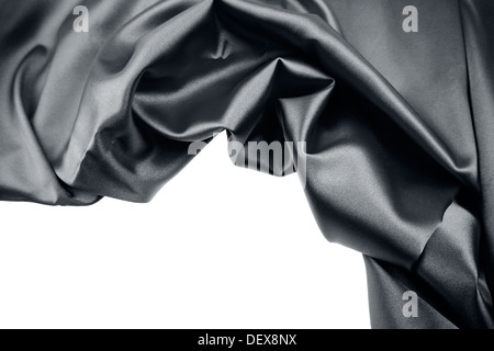 Closeup of rippled black silk fabric on plain background Stock Photo