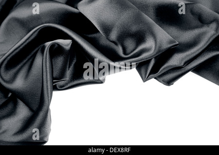 Closeup of rippled black silk fabric on plain background Stock Photo