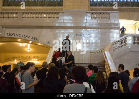 Customers line up to enter the Apple store in Grand Central Terminal as the store opens Stock Photo