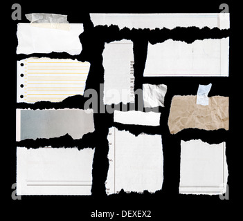 Pieces of torn paper on black. Copy space Stock Photo