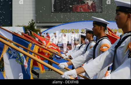 INCHON, South Korea (Sept. 15, 2013) Rear Adm. Lisa Franchetti, commander of U.S. Naval Forces Korea, waves an American flag as Stock Photo