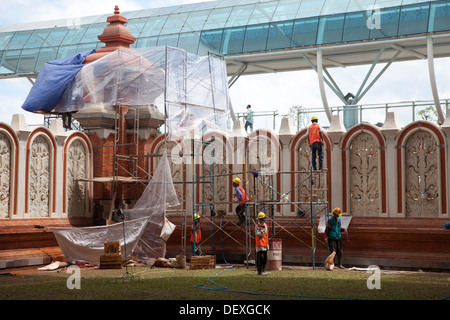 Ngurah Rai airport wing Denpasar Bali Indonesia new wing construction site modern traditional city tourist traffic brand Asia Stock Photo