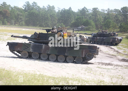 Marines with 2nd Tank Battalion, 2nd Marine Division, approach the breaching and clearing course Sept. 12, 2013, aboard Marine Corps Base Camp Lejeune. The tankers worked alongside Marines with 2nd Combat Engineer Battalion, during the breaching and clear Stock Photo