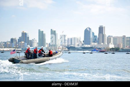 Sailors assigned to the aircraft carrier USS Ronald Reagan (CVN 76) operate a rigid-hull inflatable boat during an anti-terrorism training drill. Ronald Reagan is moored and homeported at Naval Base Coronado. Stock Photo