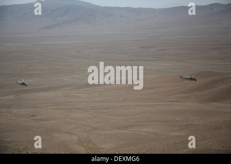 Afghan Air Force Mi-35 Hind helicopters conduct a live fire exercise to help develop the Afghan Tactical Air Coordinators in Logar Province, Afghanistan, Sept. 18, 2013. The ATAC program will help the Afghan National Army soldiers on the ground integrate