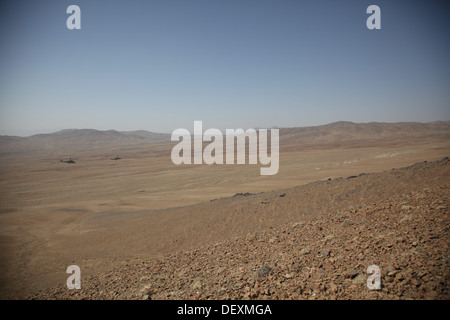 Afghan Air Force Mi-35 Hind helicopters conduct a live fire exercise to help develop the Afghan Tactical Air Coordinators in Logar Province, Afghanistan, Sept. 18, 2013. The ATAC program will help the Afghan National Army soldiers on the ground integrate