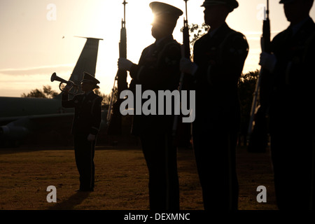 Altus AFB Honor Guard members perform a twenty-one gun salute and a bugle playing of taps during the third annual Prisoners of War and Missing in Action Remembrance Ceremony at the Wings of Freedom Park Sept. 19. This was among several events in remembran Stock Photo