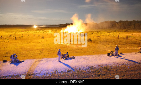 Marines with Bridge Company, 8th Engineer Support Battalion, 2nd Marine Logistics Group fire Mk. 19 Grenade Launchers during night fire as part of a grenade training exercise aboard Camp Lejeune, N.C., Sept. 17, 2013. The service members waited for illumi Stock Photo