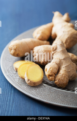 fresh ginger on vintage plate Stock Photo
