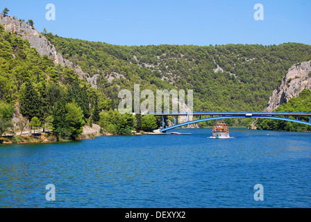 Cruise ship on the background of the bridge on the river Krka in Croatia Stock Photo