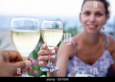 Toast for two to the sea during dinner. Stock Photo