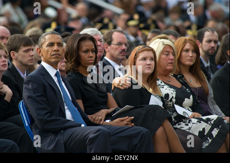 U.S. President Barack H. Obama looks on during a memorial for those killed during a shooting at the Navy Yard, at the Marine Barracks in Washington, D.C., Sept. 22, 2013. Twelve people were killed Sept. 18, 2013. Stock Photo