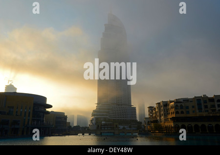 Dubai Mall in the morning mist on Lake Burj Khalifa, Emirate of Dubai, United Arab Emirates Stock Photo