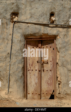 A small wooden door, Al Hazm Castle, Al Hazm, Al Batinah, Oman Stock Photo