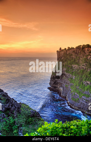 Bali, Bukit Peninsula, Uluwatu, Pura Luhur Uluwatu Temple at sunset, one of the most important directional temples of Bali Stock Photo