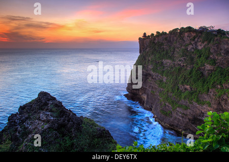 Bali, Bukit Peninsula, Uluwatu, Pura Luhur Uluwatu Temple at sunset, one of the most important directional temples of Bali Stock Photo