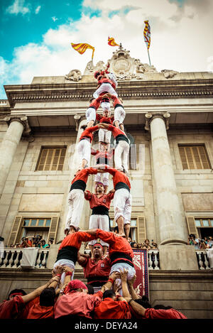Barcelona, Spain. 24th Sep, 2013: The Castellers of Barcelona build a human tower in front of Barcelona's town hall during the city festival, La Merce, 2013 © matthi/Alamy Live News Stock Photo