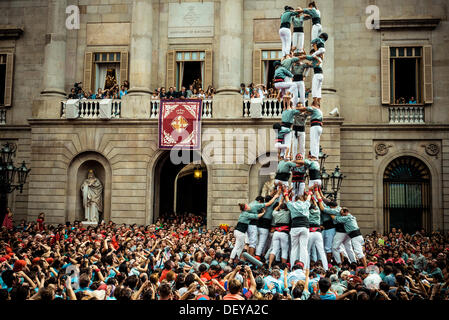 Barcelona, Spain. 24th Sep, 2013: The Castellers of Sans build a human tower in front of Barcelona's town hall during the city festival, La Merce, 2013 © matthi/Alamy Live News Stock Photo