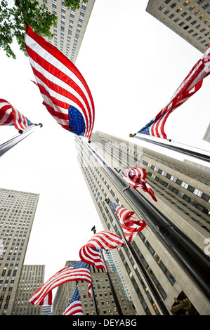 Rockefeller Center with U.S. American flags, worm's-eye view, Manhattan, New York, USA Stock Photo