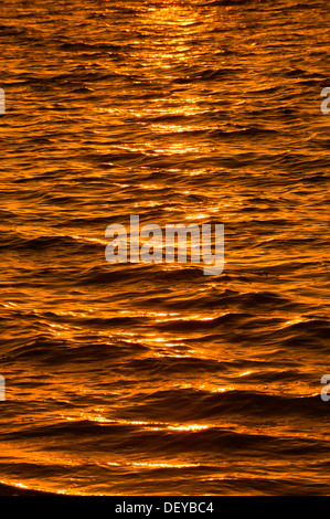 Reflections on the water surface at sunset, Sanibel Island, Florida, United States