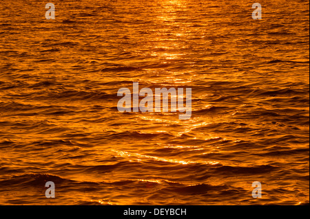 Reflections on the water surface at sunset, Sanibel Island, Florida, United States
