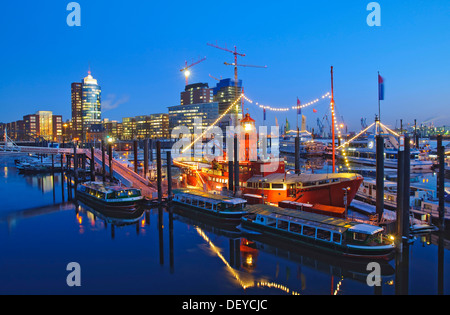 The lightship at the marina in the Hamburg harbor, in the back the HTC Hanseatic Trade Center, Hamburg Stock Photo