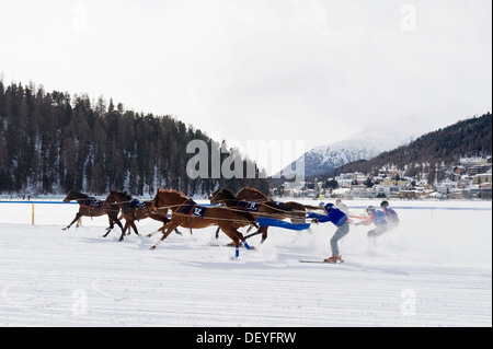 Horse racing on a frozen lake, skijoring, St. Moritz, Engadin, Graubünden, Switzerland Stock Photo
