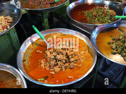 Thai curries cooking at street market, Bangkok, Thailand Stock Photo