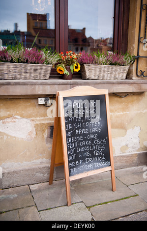 menu on blackboard in front of coffeehouse Stock Photo