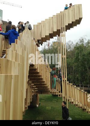 London, UK. 15th Sep, 2013. Endless stair.Escher-esque Endless Stair on the Tate Modern lawn are part of London Design Festival 2013. 187 stairs - 436m of interlocking paths are made of 11.4 tonnes of American tulipwood, an abundant material which designer Alex de Rijke predicts will be the dominant building material of the 21st century, calling it Ì¢??the new concreteÌ¢??, Tate Modern, London, UK © Veronika Lukasova/ZUMAPRESS.com/Alamy Live News Stock Photo