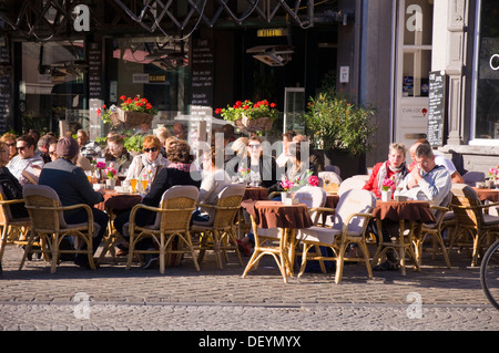 Customers sit outside Hotel de la Bourse restaurant cafe bar pub on Markt Maastricht Netherlands Stock Photo