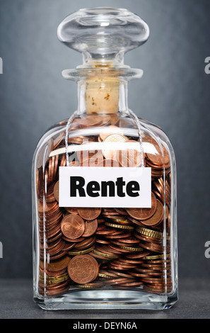 Glass jar filled with euro cent coins, labelled Rente, German for retirement Stock Photo