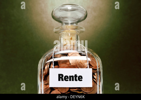 Glass jar filled with euro cent coins, labelled Rente, German for retirement Stock Photo