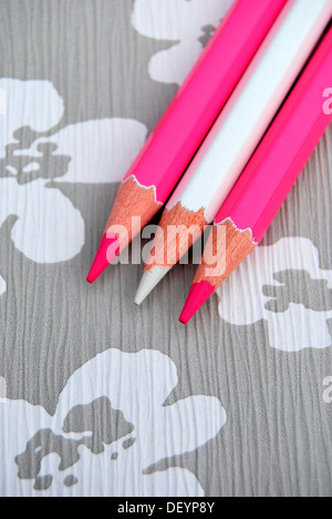 Several pencils on flowery background, creativity Stock Photo